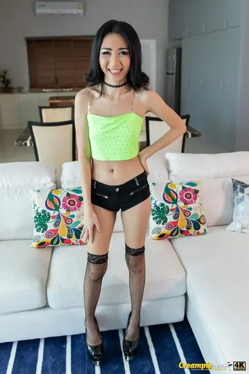 Petite Thai Woman Strips Out of Her Stockings and Heels