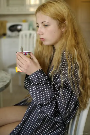 Blonde Curly Woman Spreads Her Hairy Pussy on a Kitchen Chair