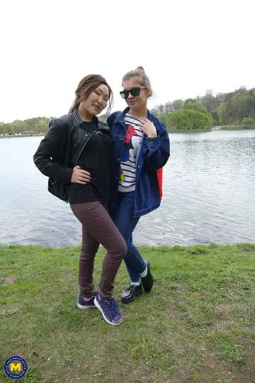 Renata Fox – Asian and European MILFs Kiss by the River in Glasses