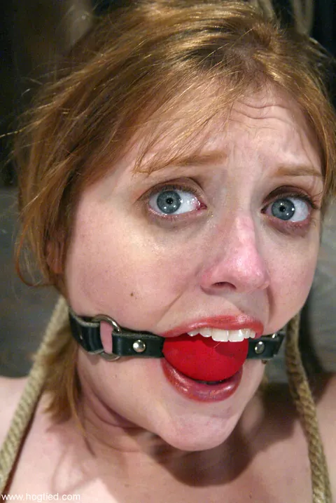 Dee Williams: Redhead with Enhanced Tits Spreads While Bound on a Table – photo 3 of 20