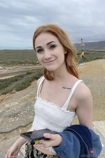 Redhead with Tattoo Spreads Her Pussy in Close-Up