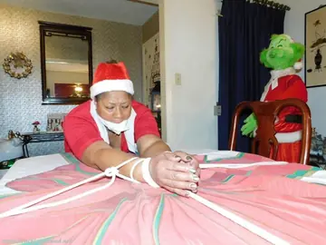 Mature Ebony Woman Tied Over a Table at Christmas in Panties