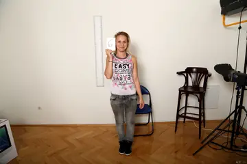 Short-Haired Woman Spreads Her Shaved Pussy