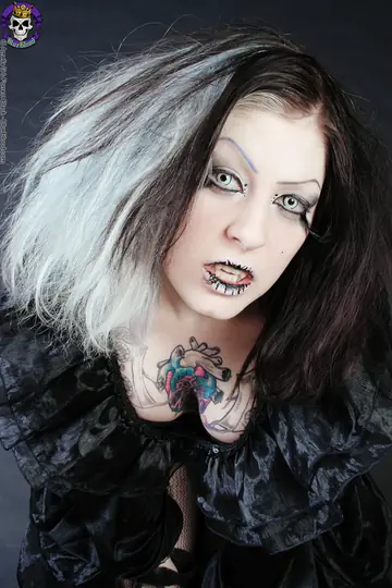 Tattooed Woman in Stockings and Costume Exposes Herself