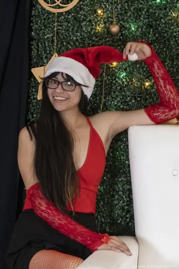 Slim Woman in Christmas Costume Spreads Her Hairy Pussy