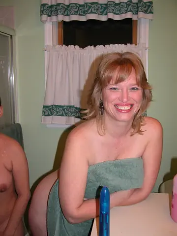 April Showers – Mature Blonde Lesbians Use a Dildo in the Bathroom