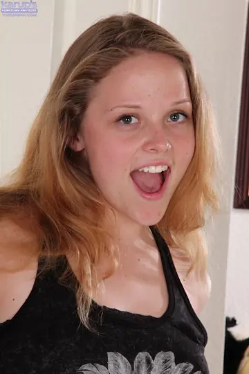 Blonde Undresses to Finger Her Shaved Pussy