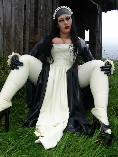 Ginger Mi: Brunette MILF with Big Tits Does Laundry in Latex Uniform Outdoors – photo 10 of 16