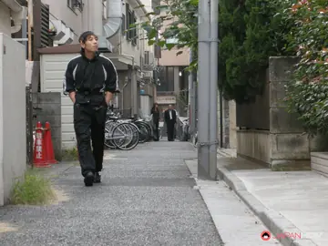 Skinny Japanese MILF Sucks Cock on Public Stairs in Leather
