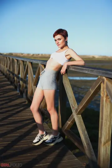 Caterina Foxy – Short-Haired Redhead Strips Off Her Shorts Outdoors and Poses in the Bathroom