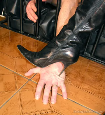 Thick Blonde in Boots Dominates Caged Man on the Stairs