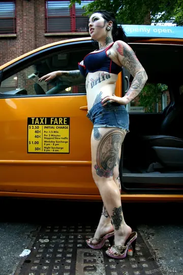 Busty Tattooed Brunette Masturbates in the Back Seat of a Car