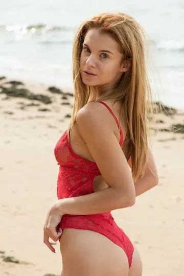 Ingrid Leanne – Slim Redhead with Big Tits Spreads in a Bodysuit on the Beach