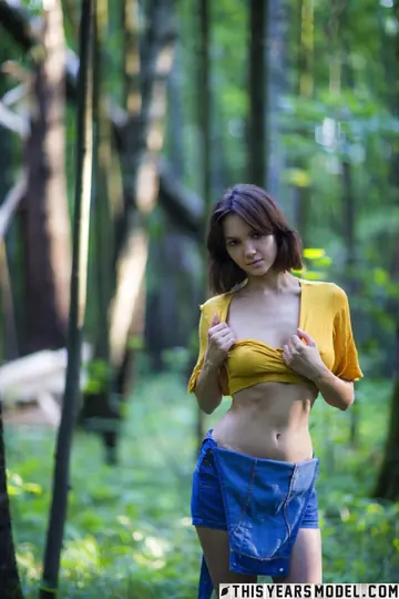 Mature Brunette MILF with Big Natural Tits Strips in the Forest
