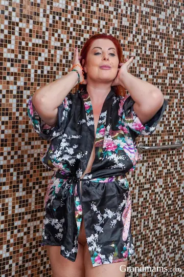 Curvy Redhead MILF Uses a Dildo in the Bathroom