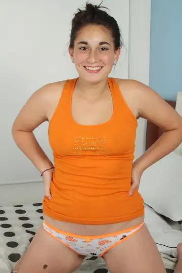Petite Latina Undresses to Reveal Her Big Ass and Hairy Pussy