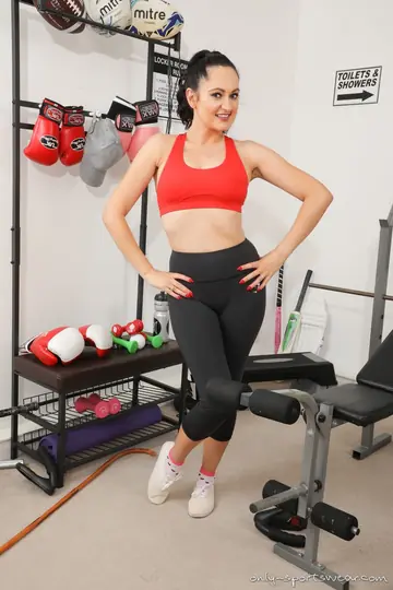 European Brunette Reveals Her Big Tits on a Gym Bench