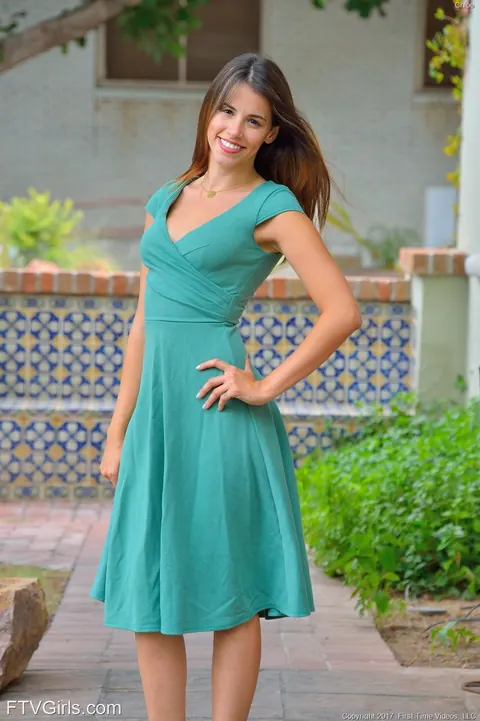 Slim Brunette in a Dress Poses in the Kitchen – photo 1 of 20