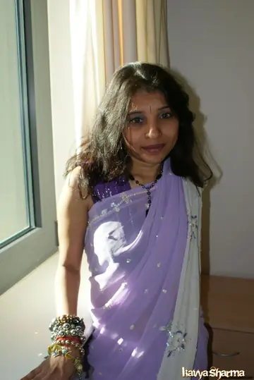 Kavya Sharma – Indian MILF in Lingerie and a Skirt Poses on the Bed