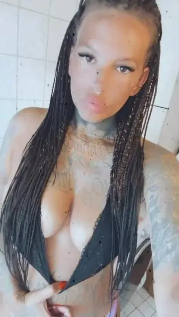 Busty Tattooed Model Poses Showing Her Curves