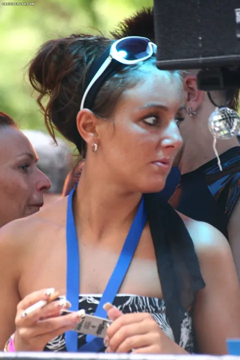 Woman in a Bikini and Skirt Exposes Her Small Breasts in Public – photo 16 of 16