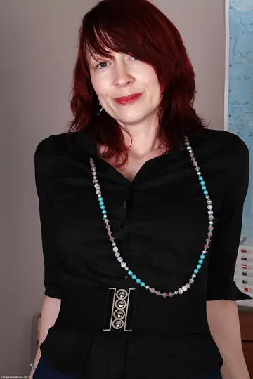 Mature Redhead with Big Tits Undresses, Shows Her Tattoos and Spreads