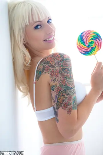 Lynn Pops – Busty Blonde in Lingerie Poses with Lollipop and Spreads