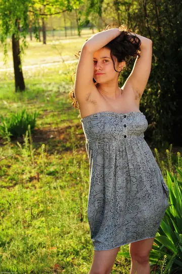 Amateur Curly Babe Shows Off Her Big Tits and Hairy Bush Outdoors
