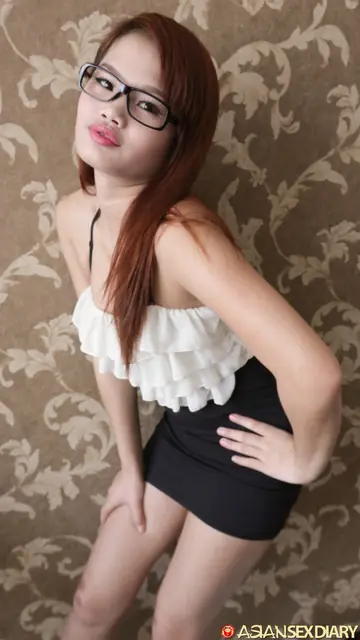 Redhead in Lingerie and Glasses Strips Nude in a Hotel Room