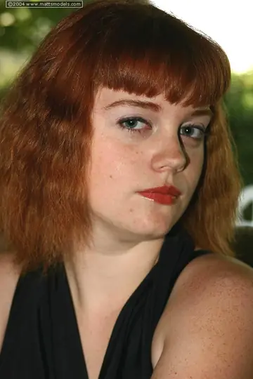 Redhead Cups Her Big Tits While Stripping Out of Her Lingerie
