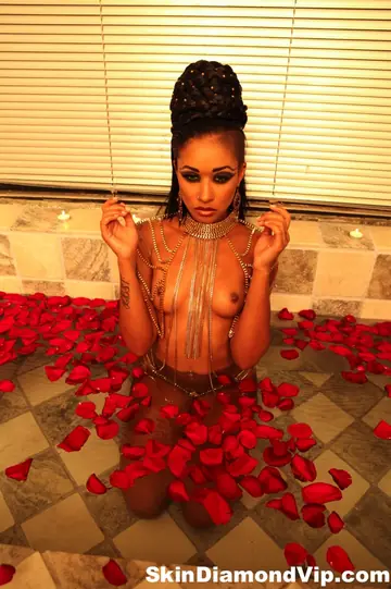 Skin Diamond – Ebony MILF Displays Her Body in a Bathtub of Red Petals