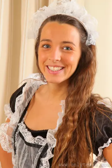 Brunette Sheds Her Maid Uniform and Poses in Stockings