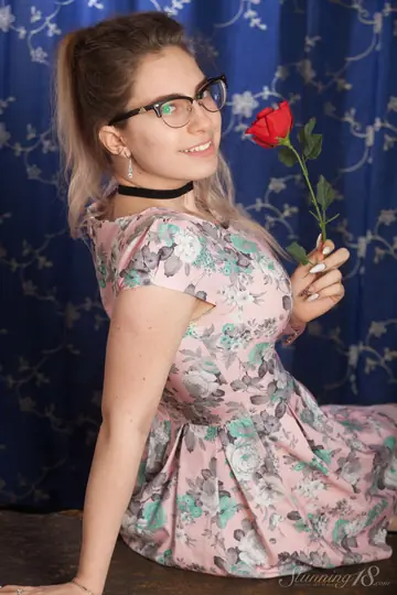 Busty Woman in Glasses, Skirt and Panties Shows Her Firm Breasts