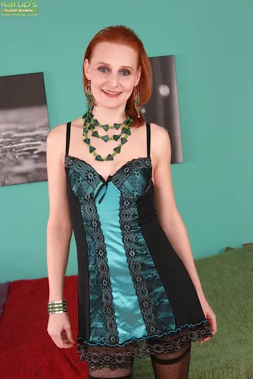 Petite Mature Redhead Strips Out of Her Lingerie and Stockings