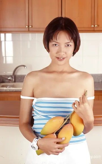 Asian Woman in High Heels Spreads Her Legs on the Kitchen Counter