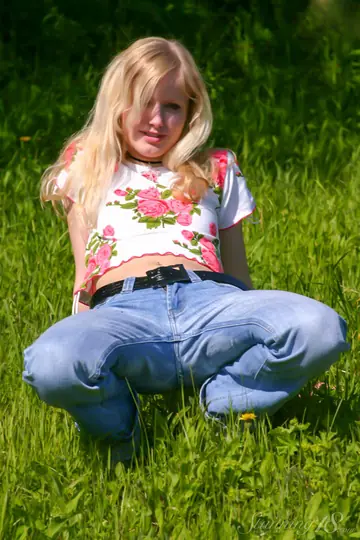 Skinny Blonde Shows Her Body in Jeans and Panties Outdoors