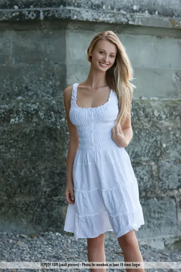 Thick Blonde Strips Out of Her Dress Outdoors and Poses Topless in Her Skirt