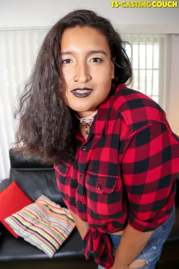 Trans Woman Undresses and Poses Nude on a Sofa for a Casting