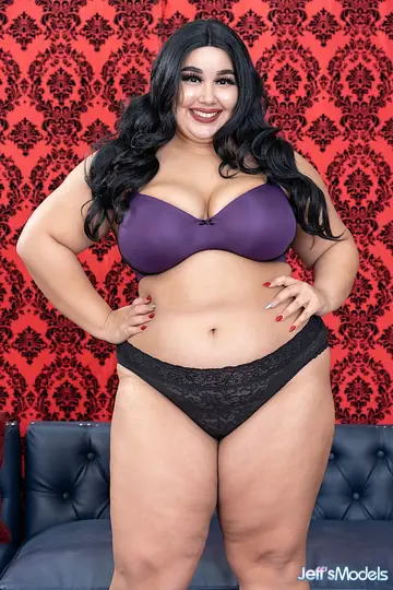 Curvy Brunette MILF Strips Out of Her Lingerie on the Sofa