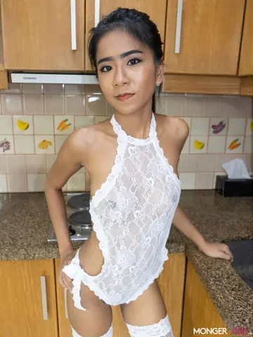 Thai Woman in Stockings Spreads Her Shaved Pussy