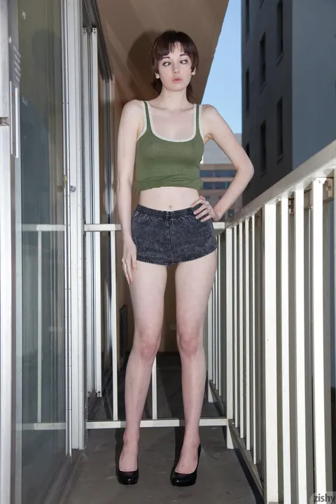 Lilly Gardner: Redhead Strips on the Balcony and Sofa – photo 4 of 11