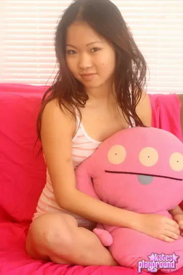 Asian Brunette in Panties Poses and Shows Her Big Ass