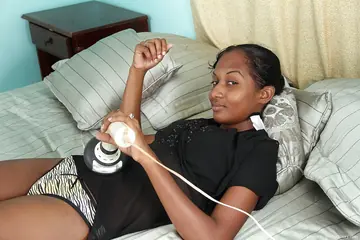 Ebony Woman in Lingerie Masturbates Her Hairy Pussy with a Dildo
