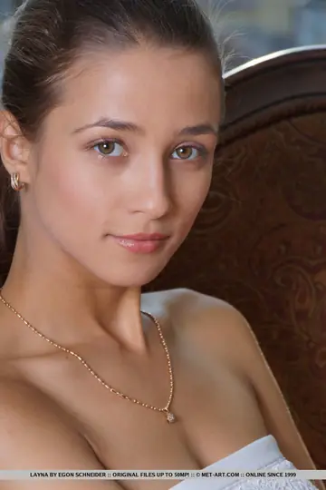 European Brunette Poses Nude After Slipping Out of Her Skirt
