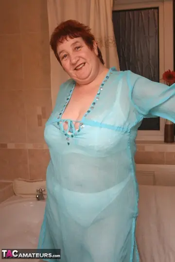 Kinky Carol – Busty Redhead in Panties and Heels Spreads in the Bathroom