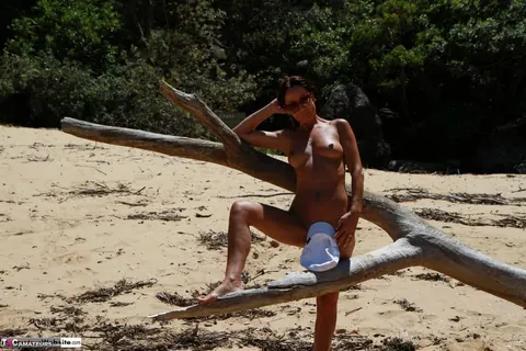 Redhead MILF with Big Tits Poses Nude at the Beach – photo 11 of 16