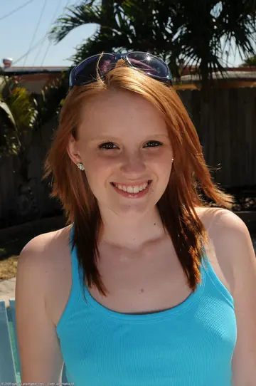 Katey Grind – Slim Redhead Strips Nude and Shows Her Tattooed Body
