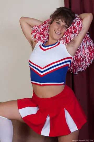 Woman in Uniform and Panties Undresses and Poses in the Bedroom