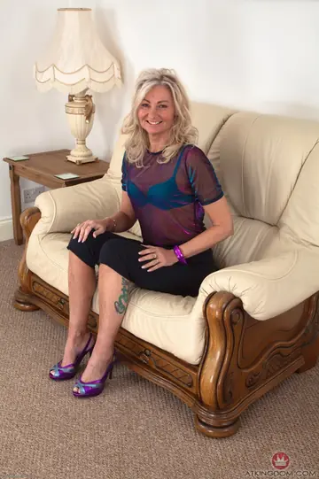 Mature Blonde Removes Her Turquoise Panties to Show Her Hairy Bush