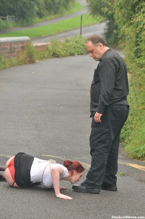 Thick Redhead Licks Boots and Crawls in Restraints Outdoors – photo 13 of 16